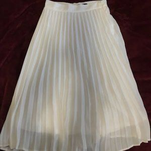 Long white pleated skirt